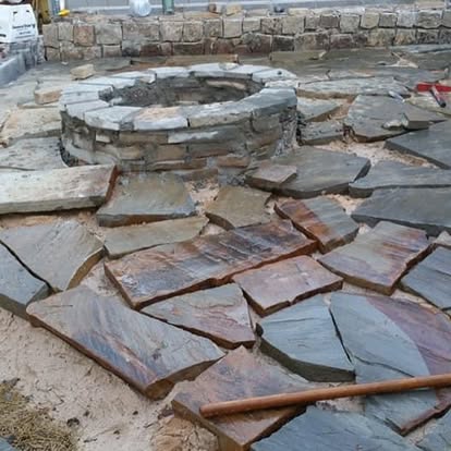 Circular paver patio and fire pit in Knoxville backyard